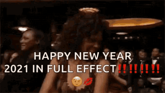 a woman is clapping her hands in front of a crowd and says happy new year 2021 in full effect !