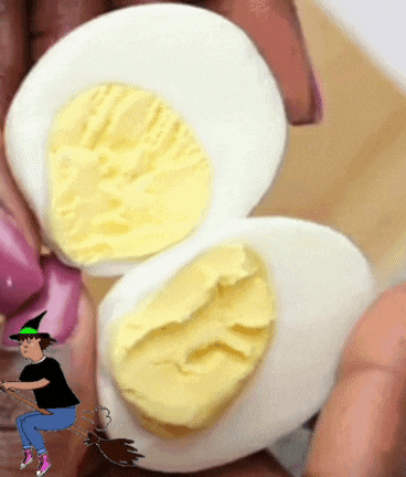 a person is holding hard boiled eggs with a cartoon of a witch on a broom