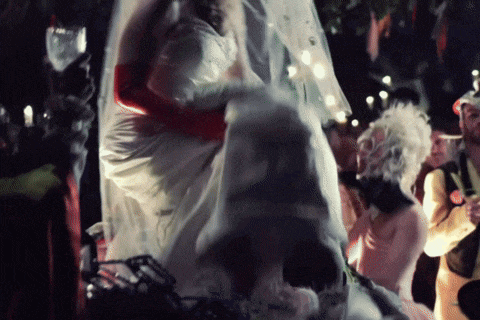 a blurry picture of a bride and groom dancing