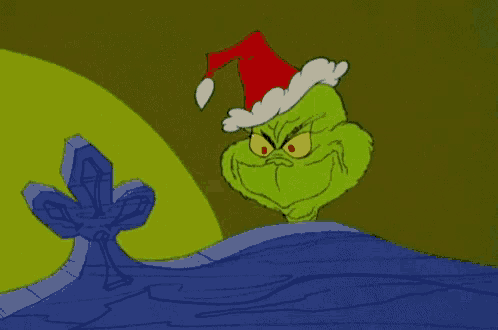 a cartoon of grinch wearing a santa hat and smiling