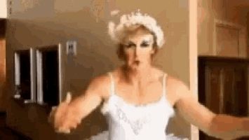 a man is dressed as a ballerina in a white dress and crown .