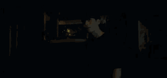 a person is walking down a dark street at night with a sign in the background that says ' korean language '
