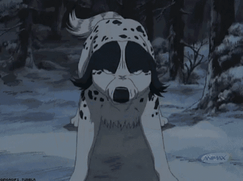 a black and white dog with the word animax on the bottom left