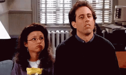 Seinfeld Shrug GIF - Seinfeld Shrug Wednesday Adams GIFs