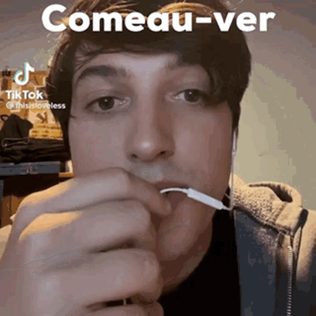 a man is holding a toothpick in his mouth with the caption comeau-ver