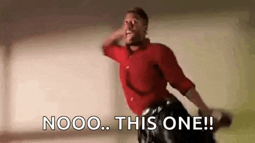 a man in a red shirt is dancing and saying `` nooo this one ! ''