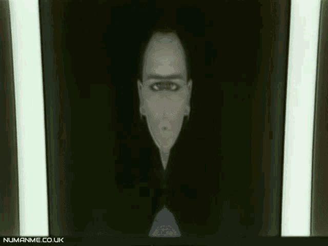 a black and white image of a person with numanime.co.uk written on the bottom right