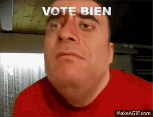 a man in a red shirt is making a funny face and the words vote bien are above him