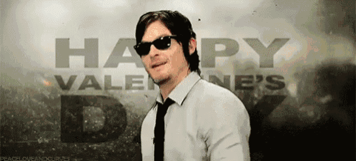 a man wearing sunglasses and a tie says happy valentine 's day .