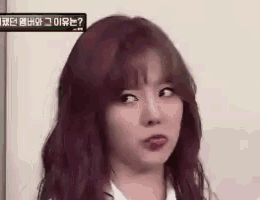 a woman with red hair is making a funny face .