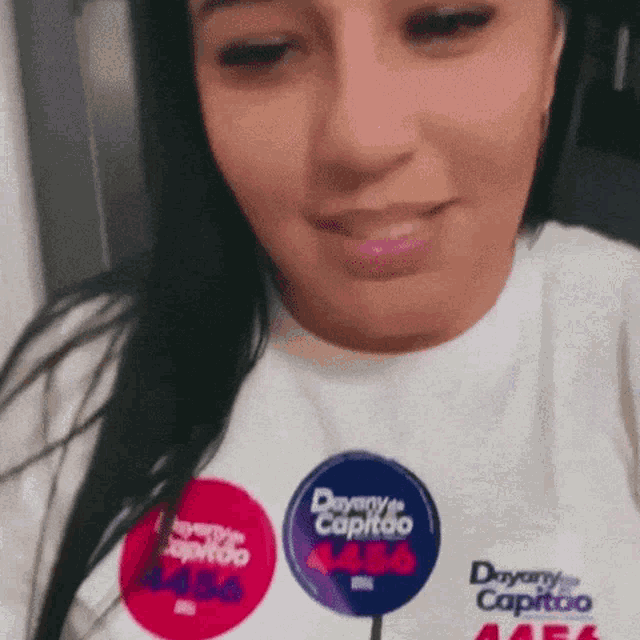 a woman wearing a t-shirt that says dryer capitoo