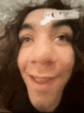 a close up of a person 's face with a toothbrush on it