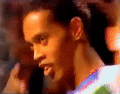 a blurry picture of a man 's face with a ponytail