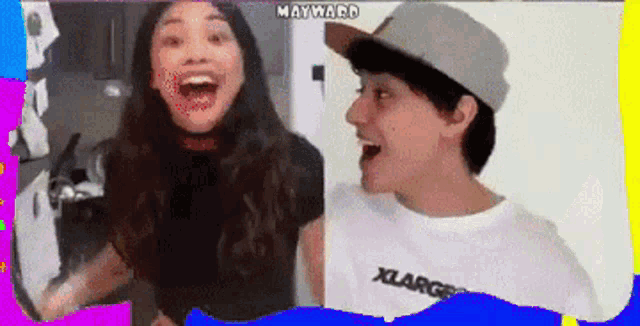 a boy and a girl are laughing together and the girl is wearing a xlarge shirt