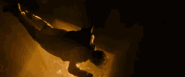 a man in a white jacket is flying through the air