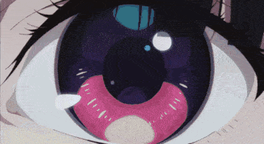 a close up of a person 's eye with a pink ring around the pupil
