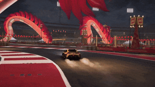 a car is driving down a race track with a sign that says ' toyota ' on it