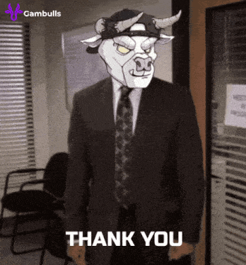 a man in a suit and tie with a bull mask on his head says thank you