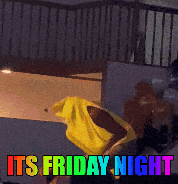 a rainbow colored sign that says its friday night on it