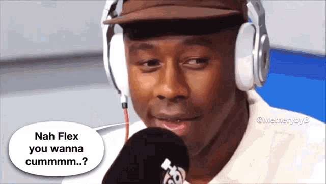 a man wearing headphones is talking into a microphone and says nah flex you wanna cummmmm