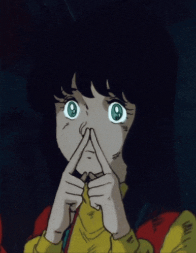 a girl with green eyes making a face with her fingers