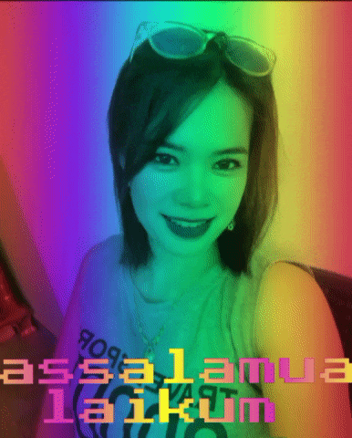a woman wearing sunglasses and a t-shirt that says assalana taikum