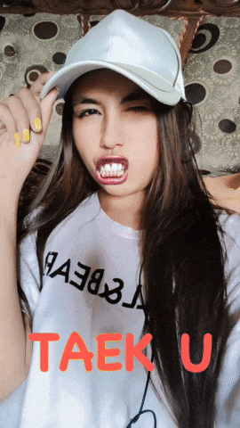 a woman wearing a white hat and a taek u shirt