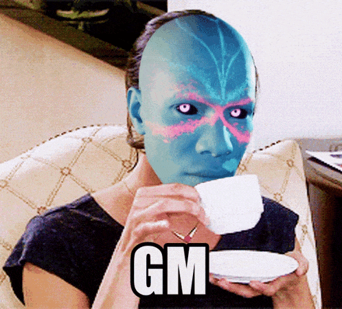 a woman with a mask on her face drinking from a cup with gm written on the bottom