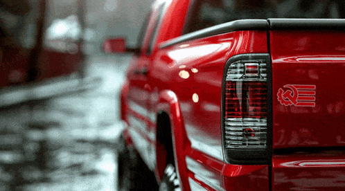 a red truck with a sticker on the back that says ' e ' on it