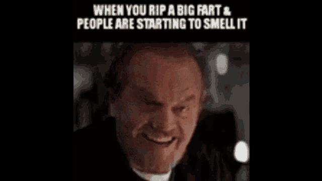 a man is smiling with a caption that says `` when you rip a big fart and people are starting to smell it ''