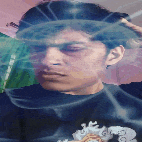 a man wearing a black shirt with a picture of a sheep on it