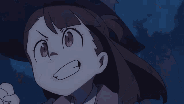 a close up of a girl 's face with her mouth wide open