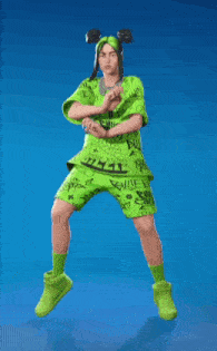 billie eilish is jumping in the air wearing a green shirt and shorts
