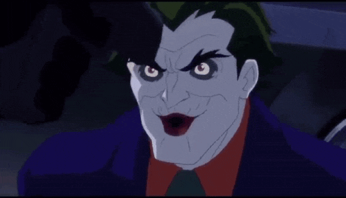 the joker from the batman animated series is smiling and looking at the camera with a serious look on his face .
