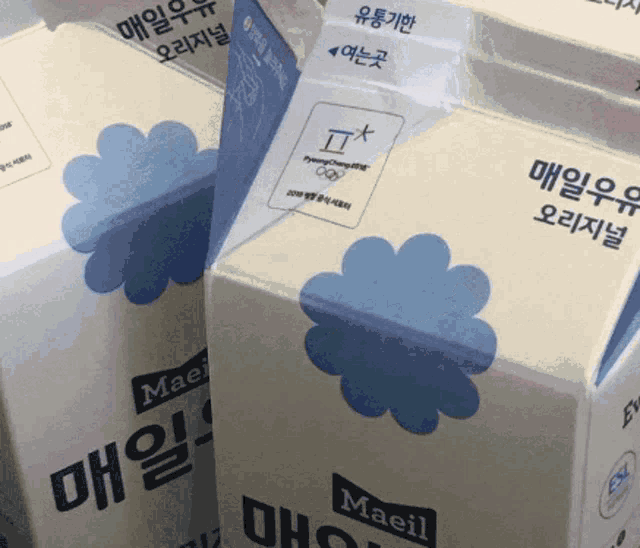 three boxes of maeil milk are stacked on top of one another