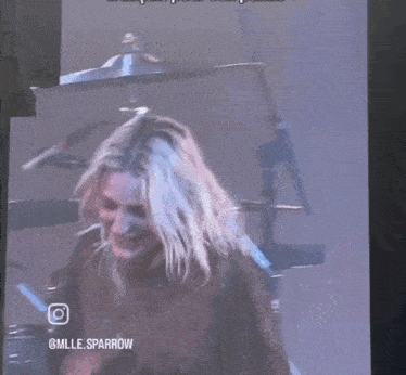 a woman is playing drums in front of a drum set with the words mille sparrow on the bottom of the screen