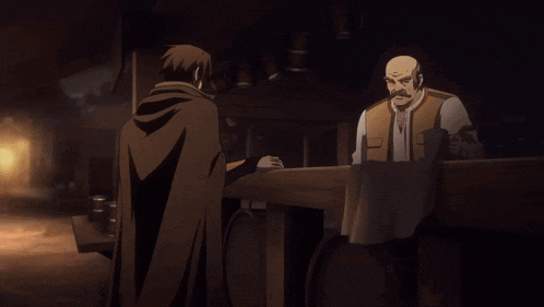 a man in a cape talks to another man