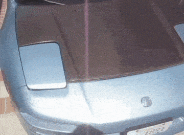 a blue sports car with a california license plate that says l891