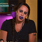 a woman wearing purple lipstick and a braided ponytail