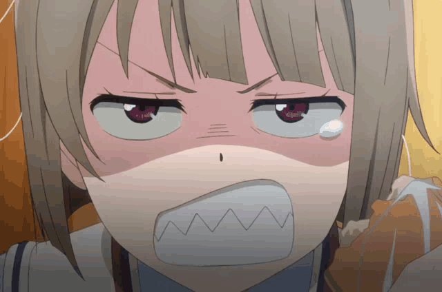 a close up of a girl making a shark face with her mouth open