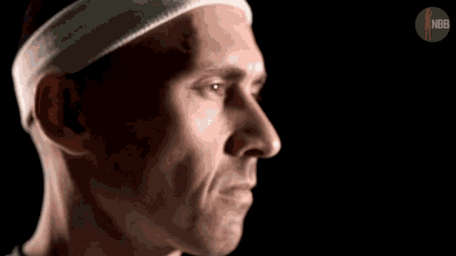 a man wearing a headband with the word nbb on it