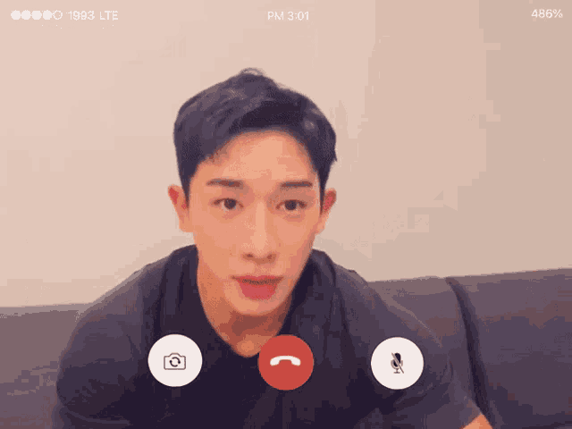 a phone screen shows a man on a video call at 3:01 pm