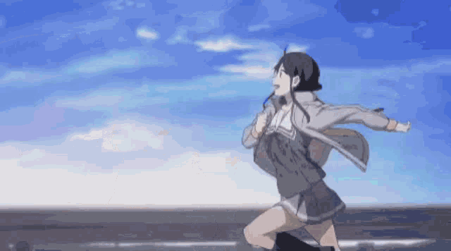 a girl is running in the air with her arms outstretched .