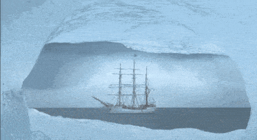 a ship in the ocean with a flag on top of it