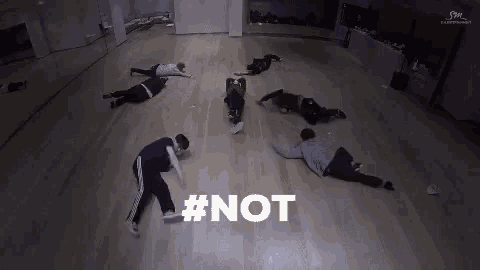 a group of people are laying on the floor in a dance studio with the hashtag # not .