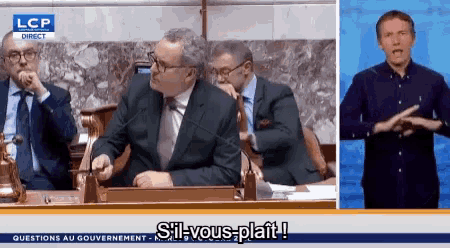 a group of men sitting at a table with the words sil-vous-platt written on the bottom