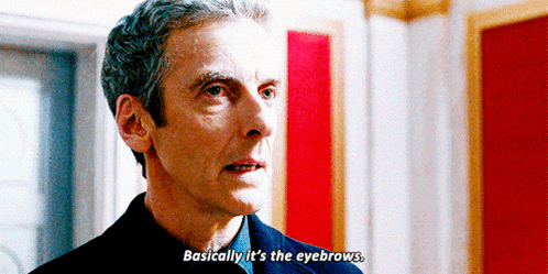 a man in a suit is talking about his eyebrows