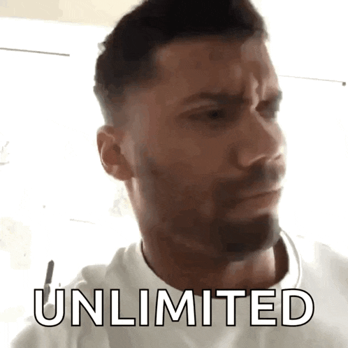 a man with a beard is wearing a white shirt and says unlimited on his face