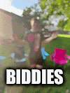 a blurry picture of a person holding a frisbee with the word biddies written on it
