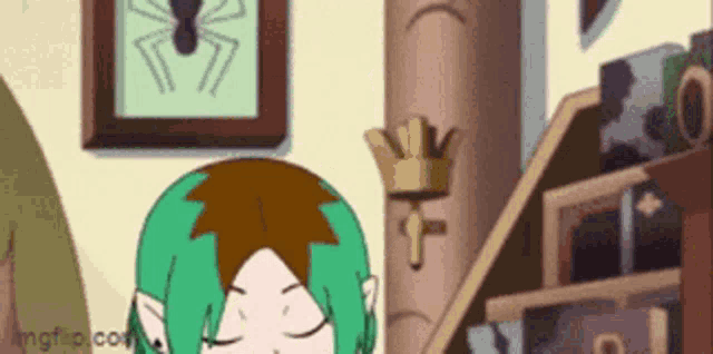 a cartoon girl with green hair is sitting in a room with a spider on the wall .